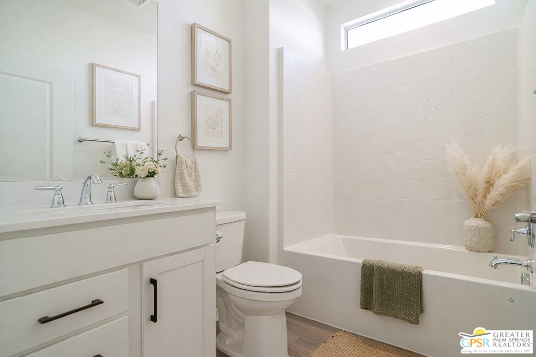 78924 Santa Rosa Way Palm Desert, CA 92211 - Photo 13 of 71 a bathroom with a sink a toilet and shower