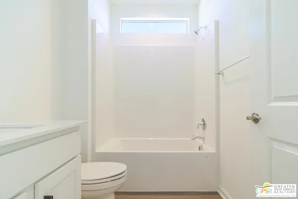 a kitchen with kitchen island a sink stainless steel appliances and cabinets