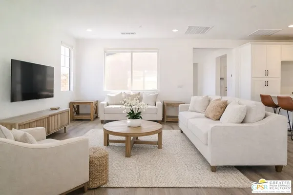 a bathroom with a tub and a potted plant