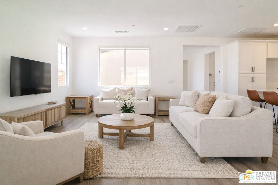 78924 Santa Rosa Way Palm Desert, CA 92211 - Photo 21 of 71 a living room with furniture and a flat screen tv