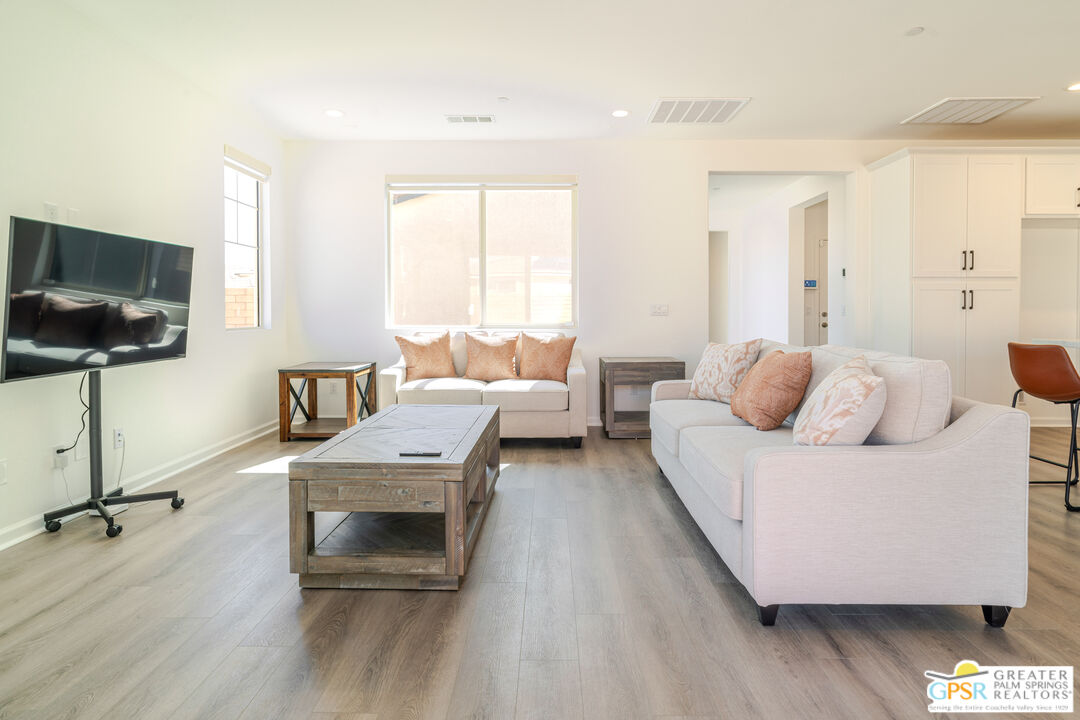 78924 Santa Rosa Way Palm Desert, CA 92211 - Photo 22 of 71 a living room with furniture and a flat screen tv