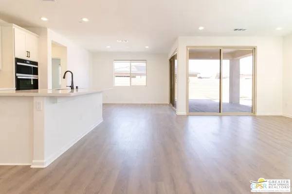 a view of a backyard of the house