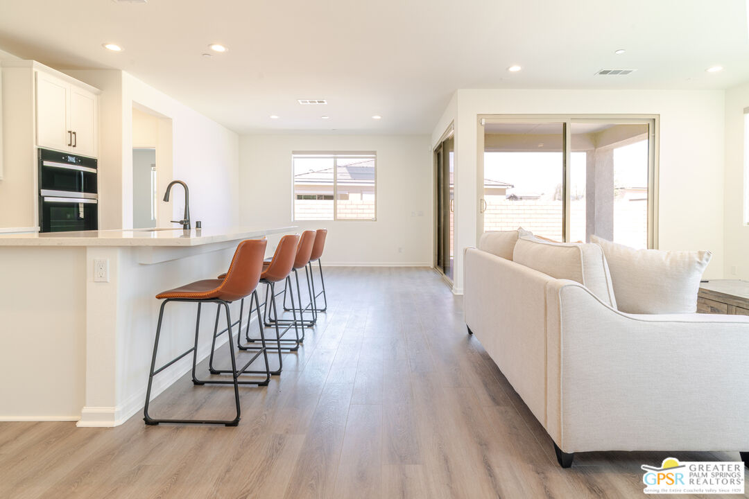 78924 Santa Rosa Way Palm Desert, CA 92211 - Photo 27 of 71 a living room with furniture and a wooden floor