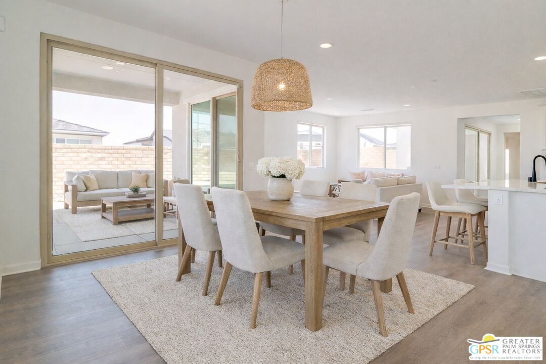 78924 Santa Rosa Way Palm Desert, CA 92211 - Photo 30 of 71 a view of a dining room with furniture window and wooden floor