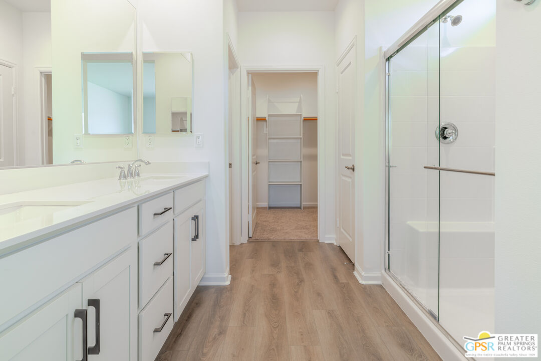 78924 Santa Rosa Way Palm Desert, CA 92211 - Photo 48 of 71 a bathroom with a sink a mirror and a shower