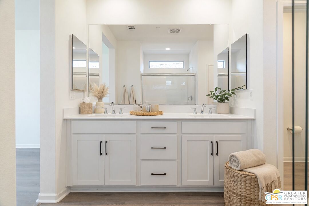 78924 Santa Rosa Way Palm Desert, CA 92211 - Photo 51 of 71 a bathroom with a sink vanity granite and a mirror