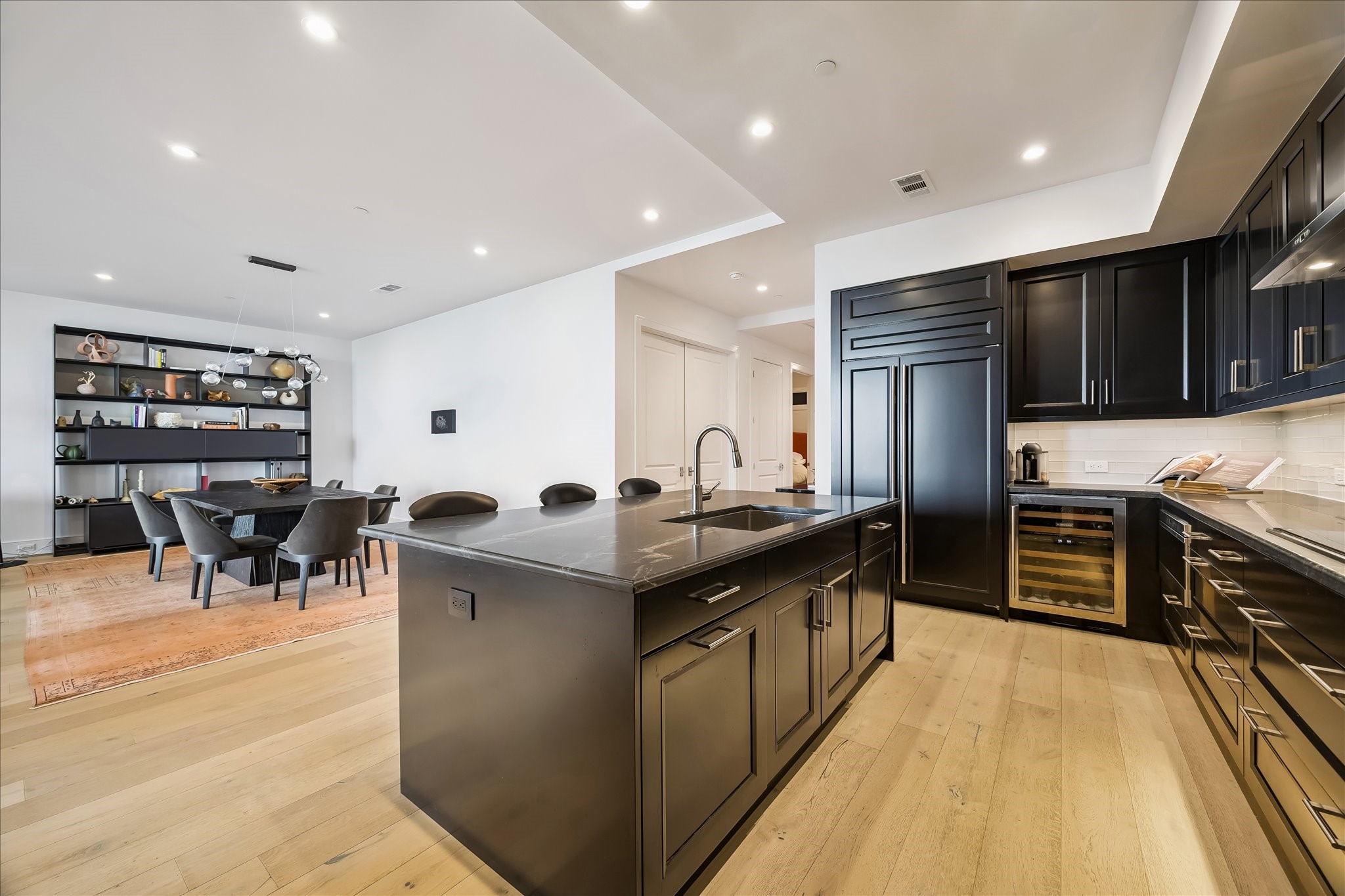 2325 Welch Street, Unit 704 Houston, TX 77019 - Photo 17 of 33 Thoughtfully designed with custom cabinetry, premium appliances, and a spacious island, this kitchen balances beauty and functionality. Its open-concept layout makes it ideal for entertaining.