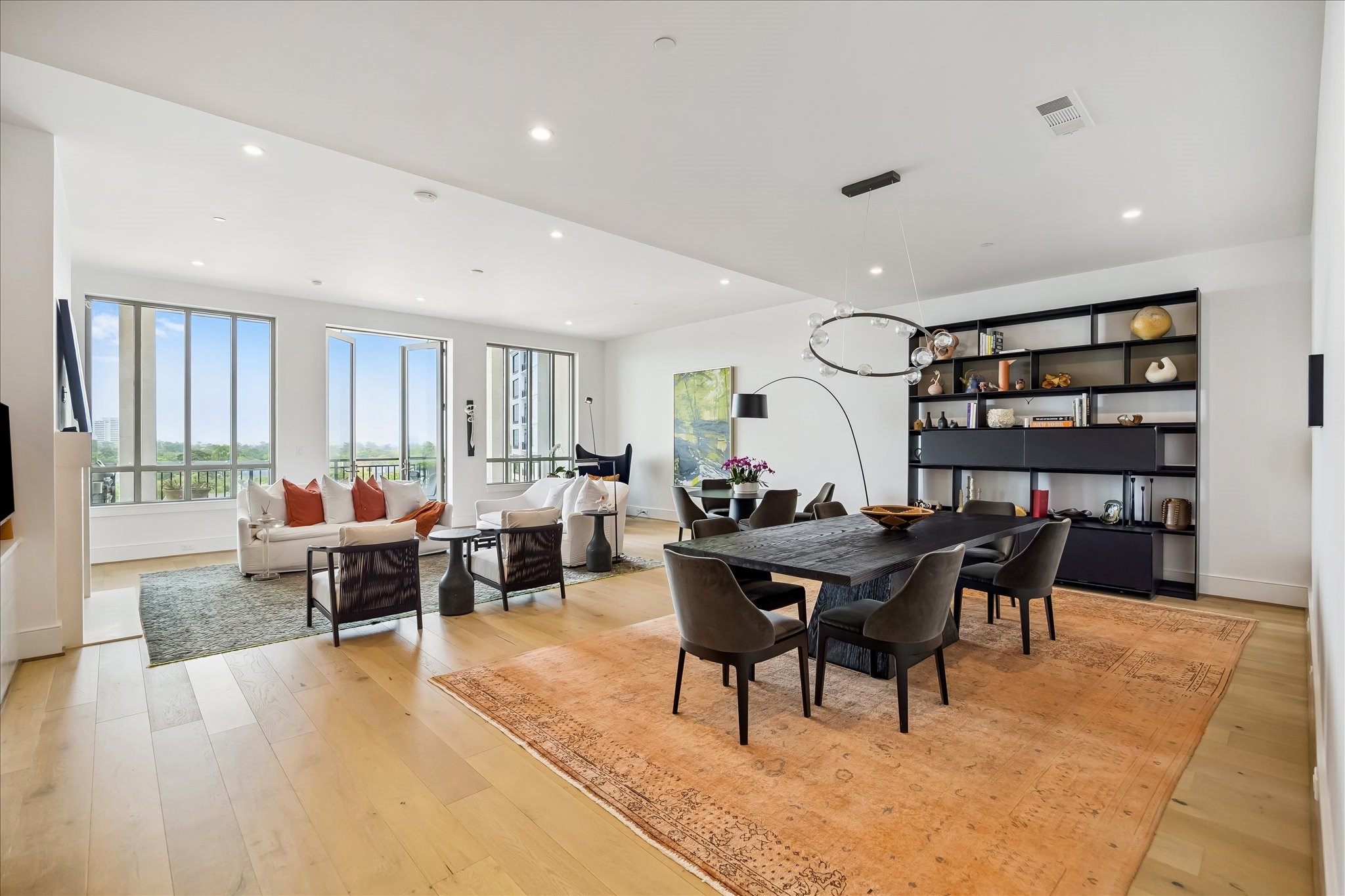 2325 Welch Street, Unit 704 Houston, TX 77019 - Photo 19 of 33 Designed with both style and function in mind, the dining room features clean lines, elevated ceilings, and a welcoming open-concept layout.