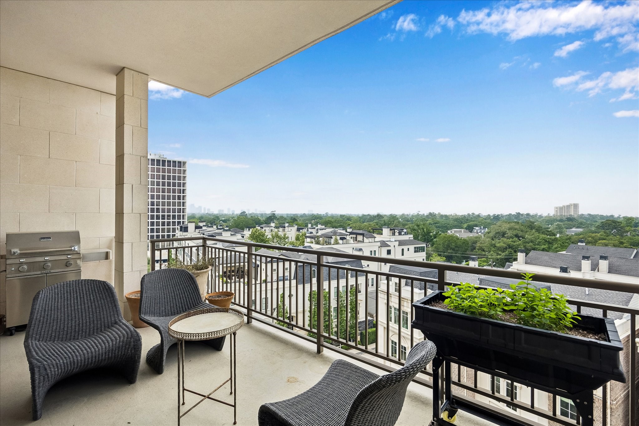 2325 Welch Street, Unit 704 Houston, TX 77019 - Photo 2 of 33 Enjoy a private, covered balcony just off the living room with serene north-facing views. The perfect spot for morning coffee or relaxing evenings outdoors.