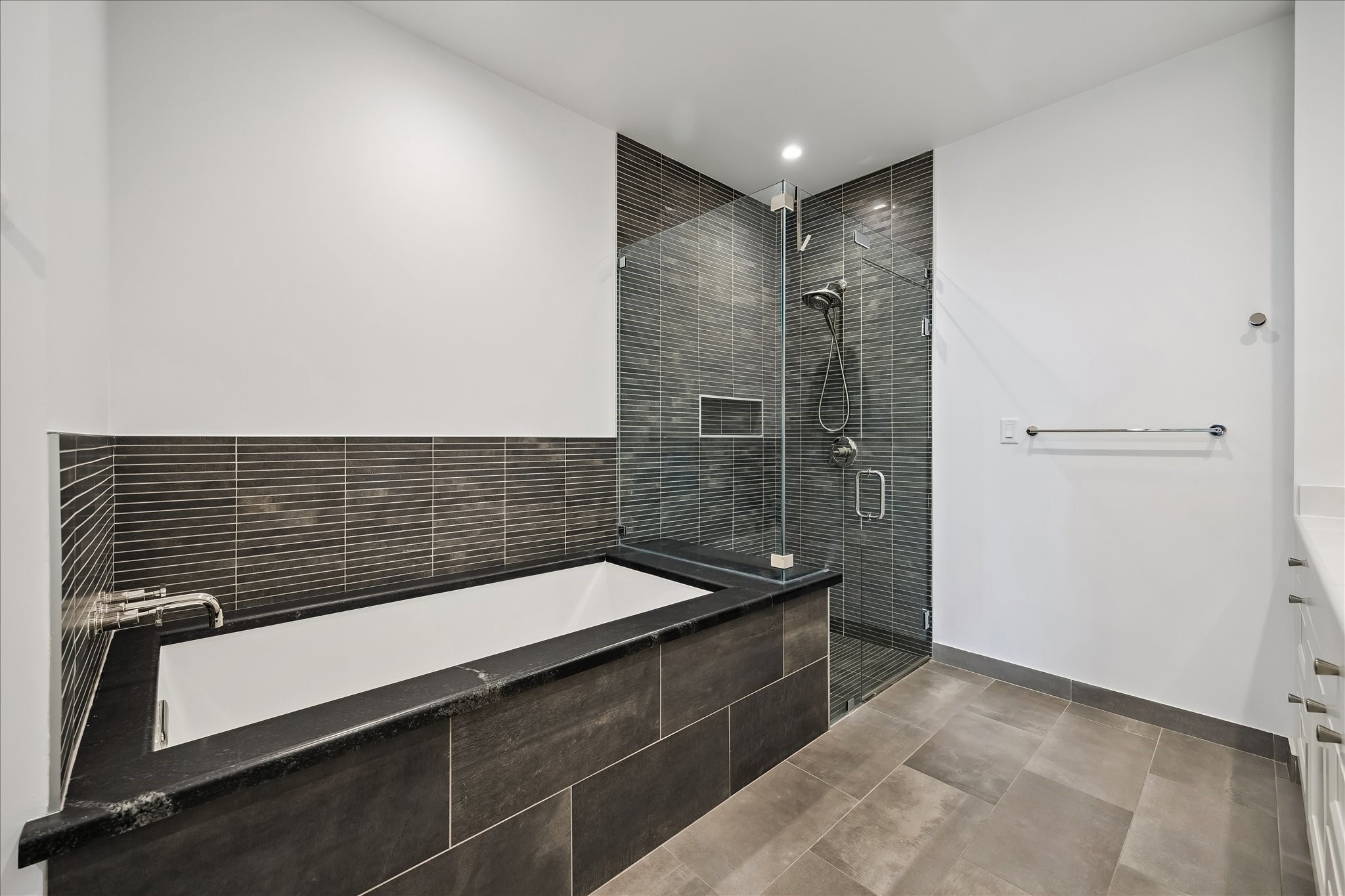 2325 Welch Street, Unit 704 Houston, TX 77019 - Photo 26 of 33 Elegant and well-appointed, the primary bath features a spacious walk-in shower, soaking tub, and dedicated water closet. Direct access to the walk-in closet adds convenience to this refined space.