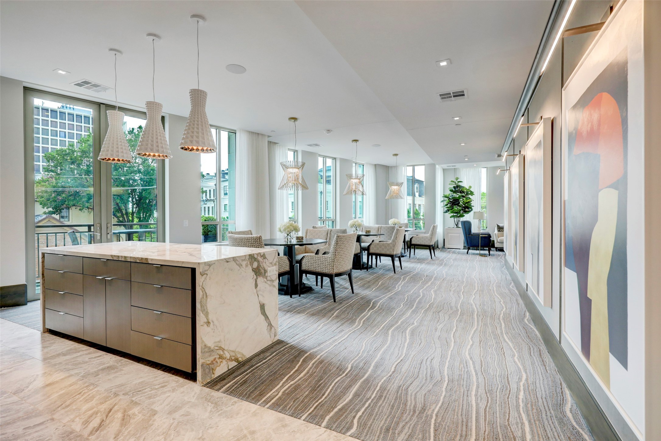 2325 Welch Street, Unit 704 Houston, TX 77019 - Photo 32 of 33 The third-floor lounge with a full kitchen offers an inviting, stylish setting perfect for entertaining. Ideal for hosting gatherings or special events, this thoughtfully designed space is available for residents to reserve as well.