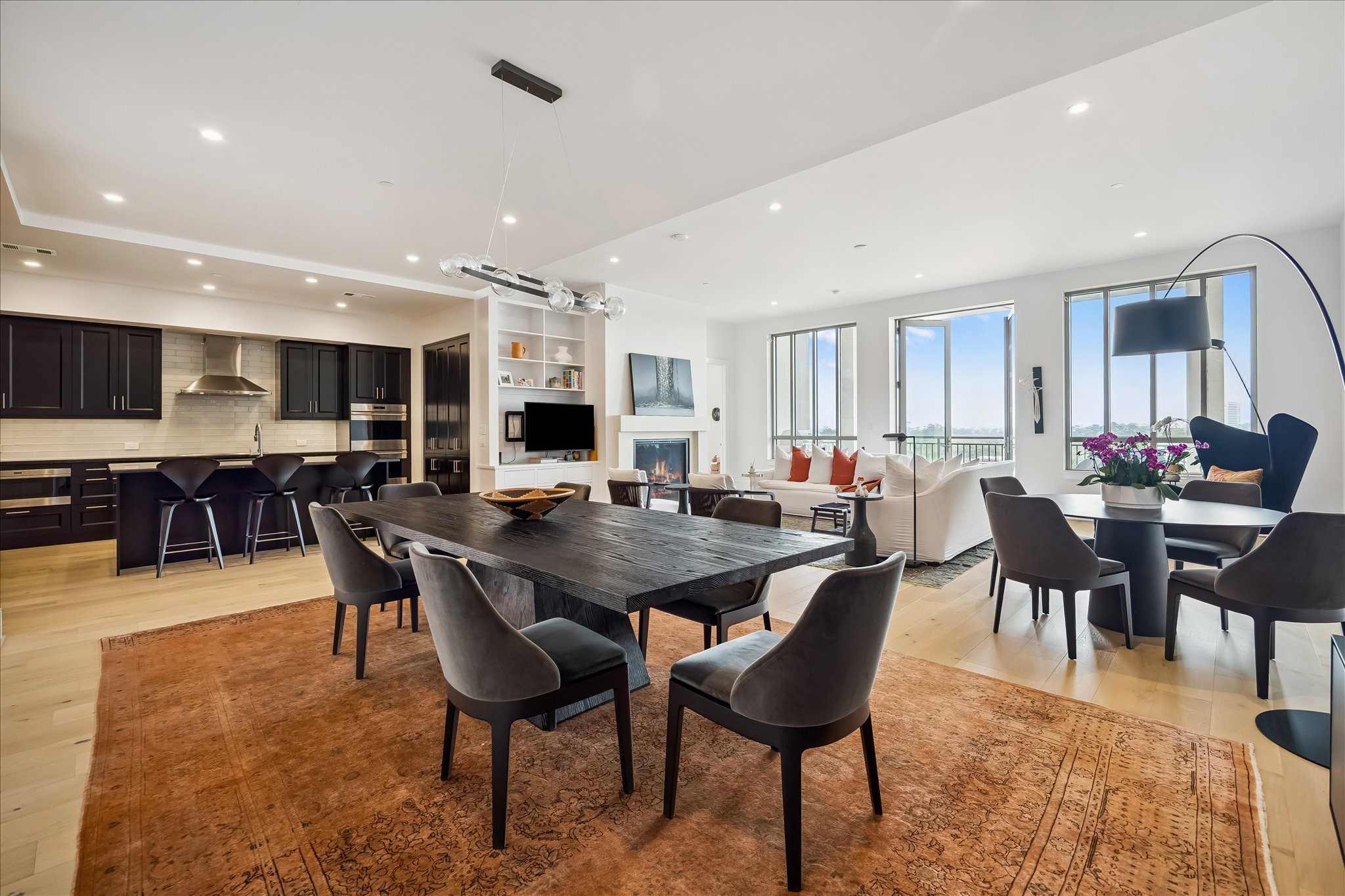 2325 Welch Street, Unit 704 Houston, TX 77019 - Photo 9 of 33 Light-filled and beautifully proportioned, this dining space blends sophistication with comfort. Seamless access to the kitchen and living room makes hosting effortless.