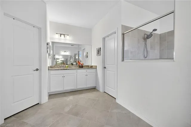 a view of a bathroom with a shower and a sink