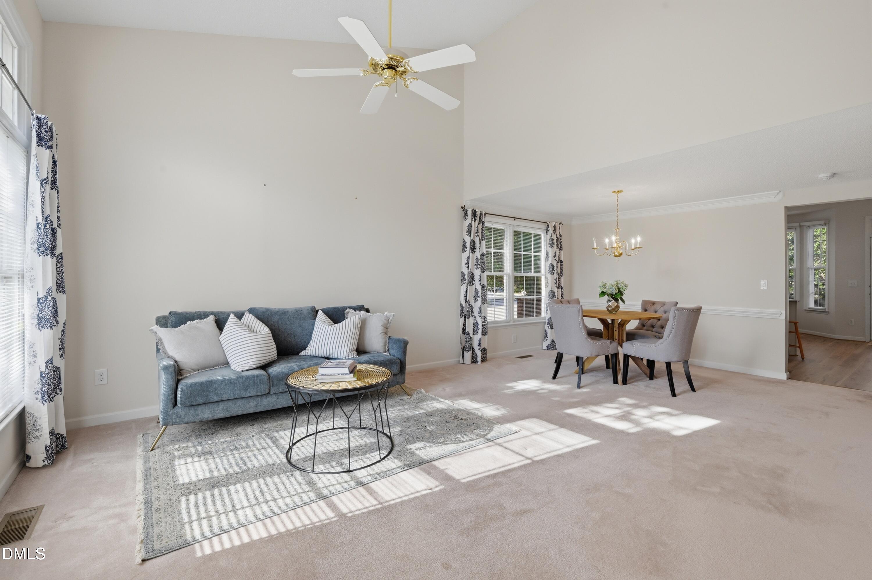 6801 Lynnoak Drive Raleigh, NC 27613 - Photo 6 of 30 a living room with furniture and a window