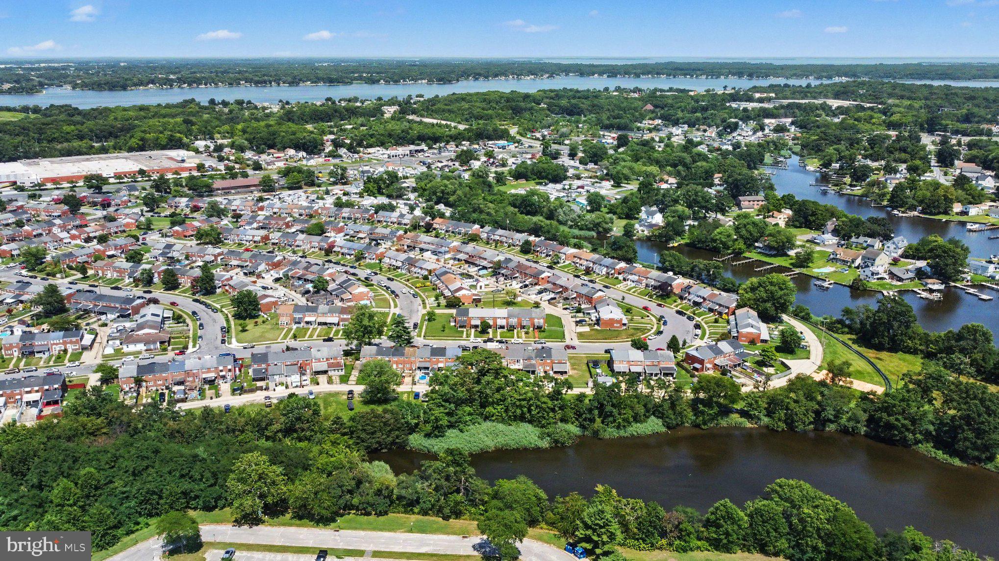 7729 Charlesmont Road Baltimore, MD 21222 - Photo 39 of 43 an aerial view of residential houses with outdoor space and lake view