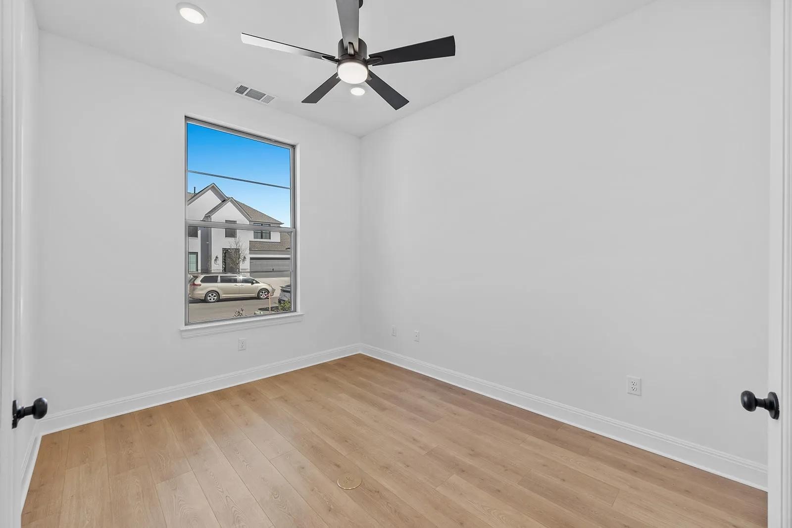308 Buckaroo Drive Georgetown, TX 78633 - Photo 7 of 31 an empty room with a window and ceiling fan