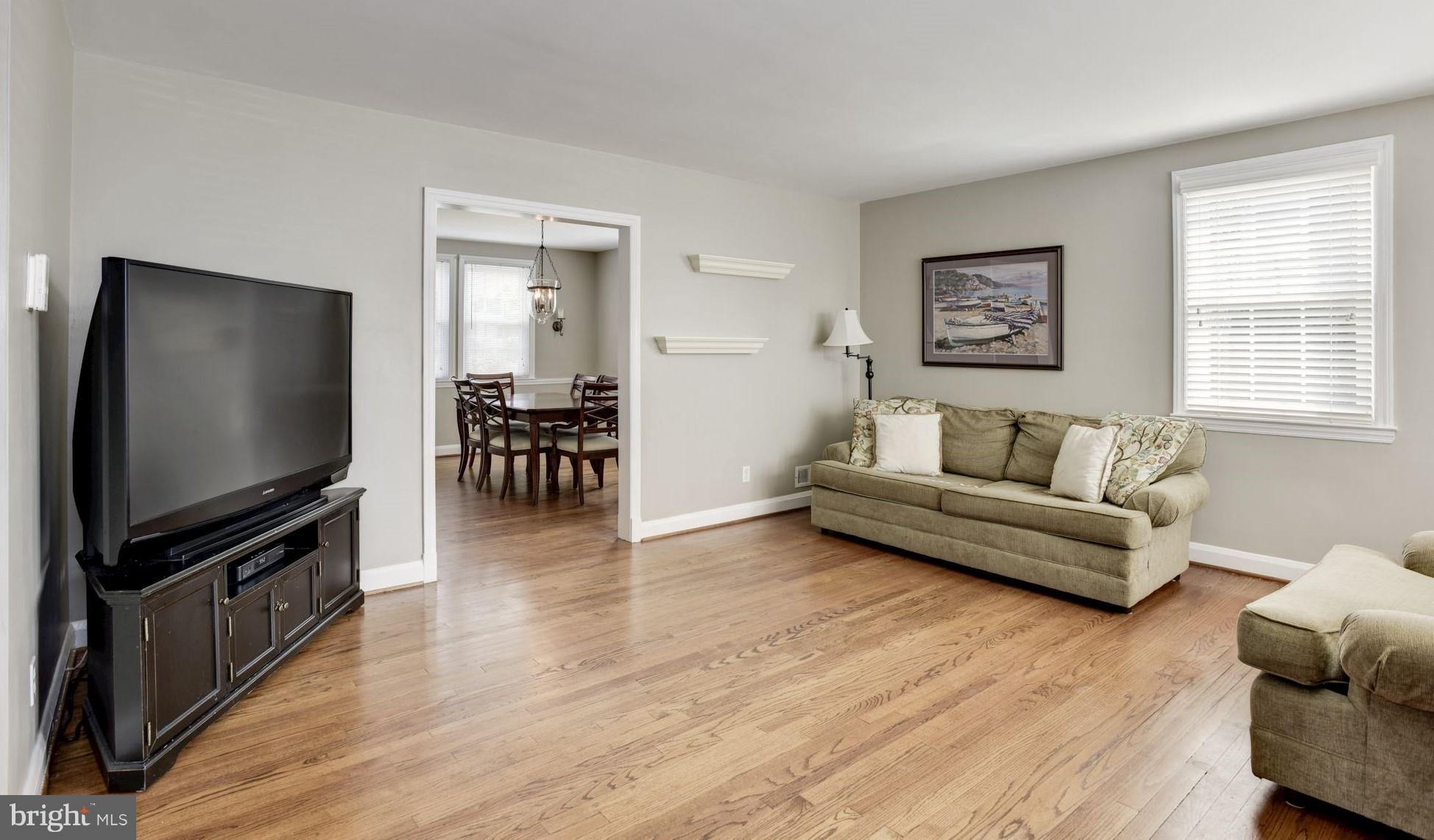 420 Stratford Road Baltimore, MD 21228 - Photo 3 of 26 a living room with furniture and a flat screen tv