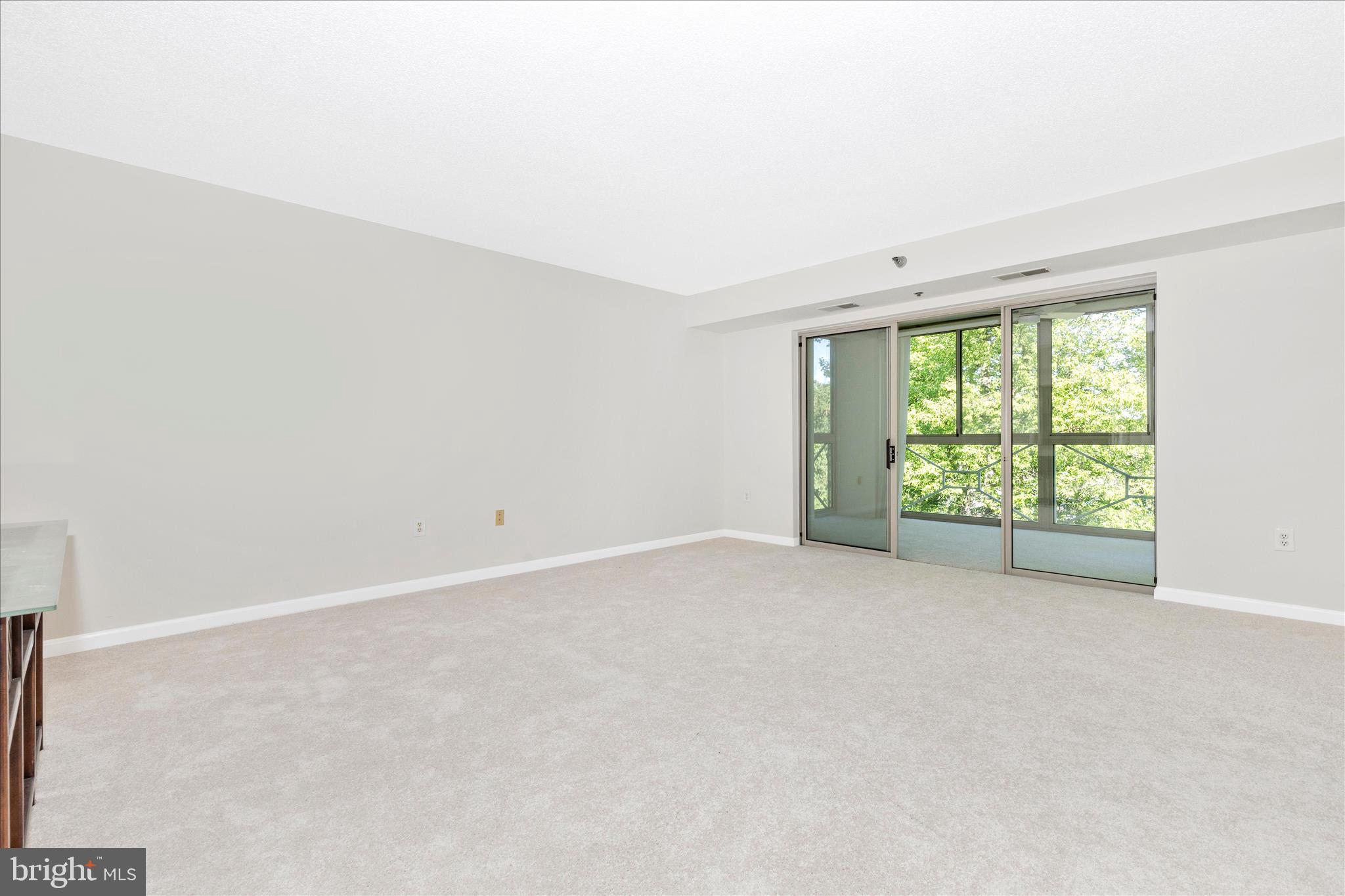 14809 Pennfield Circle, Unit 309 Silver Spring, MD 20906 - Photo 11 of 64 a view of an empty room with a window