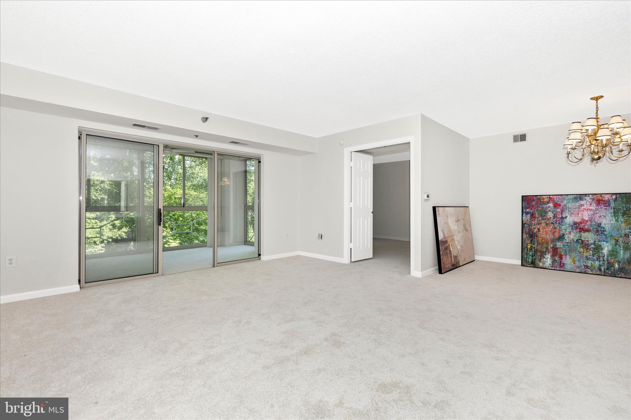14809 Pennfield Circle, Unit 309 Silver Spring, MD 20906 - Photo 12 of 64 an empty room with furniture and a large window