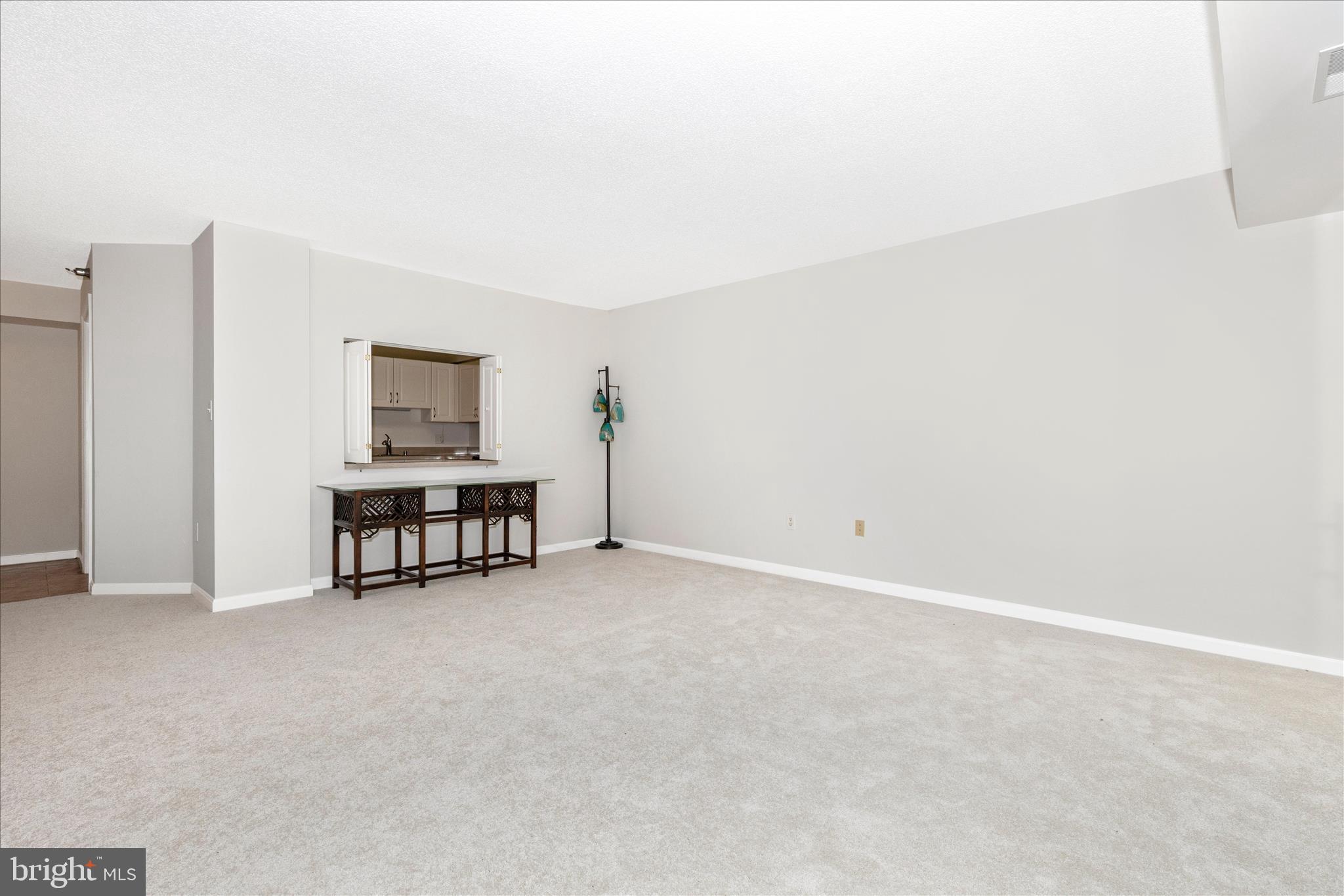 14809 Pennfield Circle, Unit 309 Silver Spring, MD 20906 - Photo 15 of 64 Living room opening to kitchen