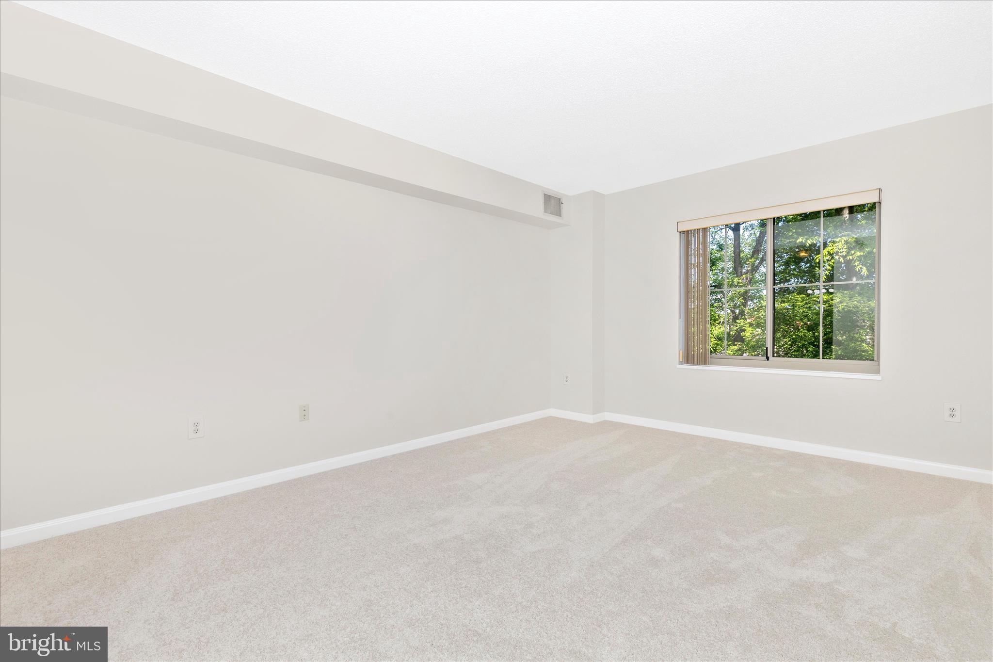 14809 Pennfield Circle, Unit 309 Silver Spring, MD 20906 - Photo 17 of 64 an empty room with windows