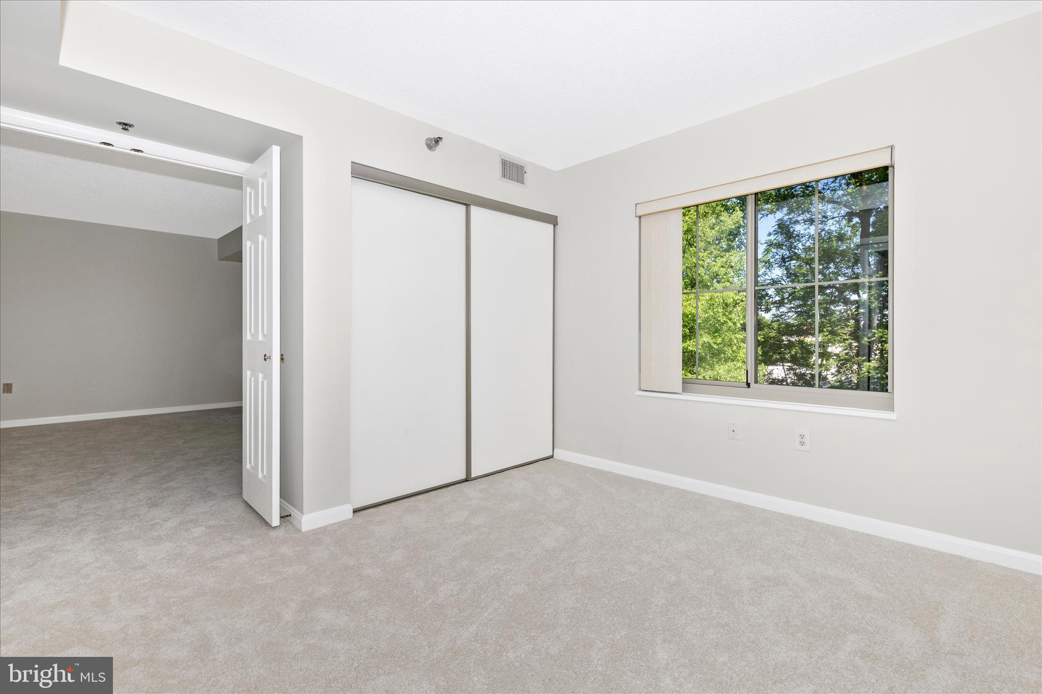 14809 Pennfield Circle, Unit 309 Silver Spring, MD 20906 - Photo 23 of 64 a view of an empty room with a window
