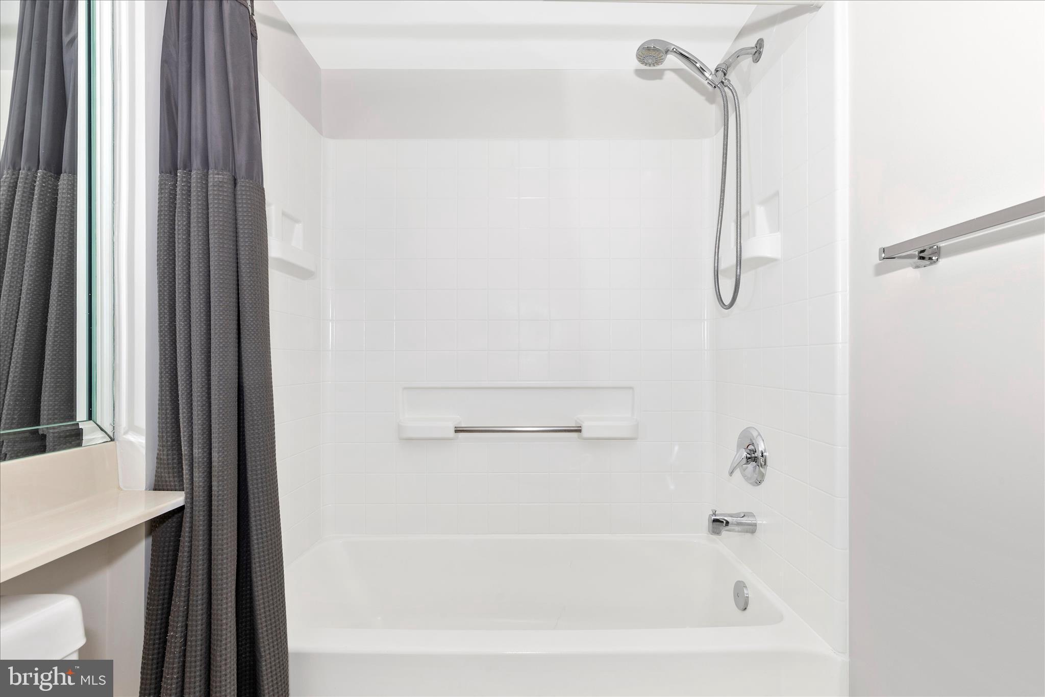 14809 Pennfield Circle, Unit 309 Silver Spring, MD 20906 - Photo 27 of 64 a bathroom with a bathtub