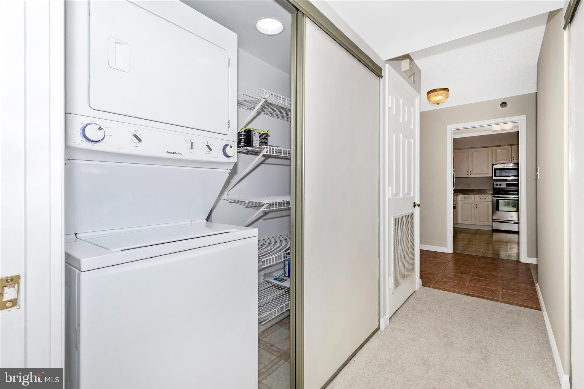 14809 Pennfield Circle, Unit 309 Silver Spring, MD 20906 - Photo 28 of 64 a view of hallway with washer and dryer
