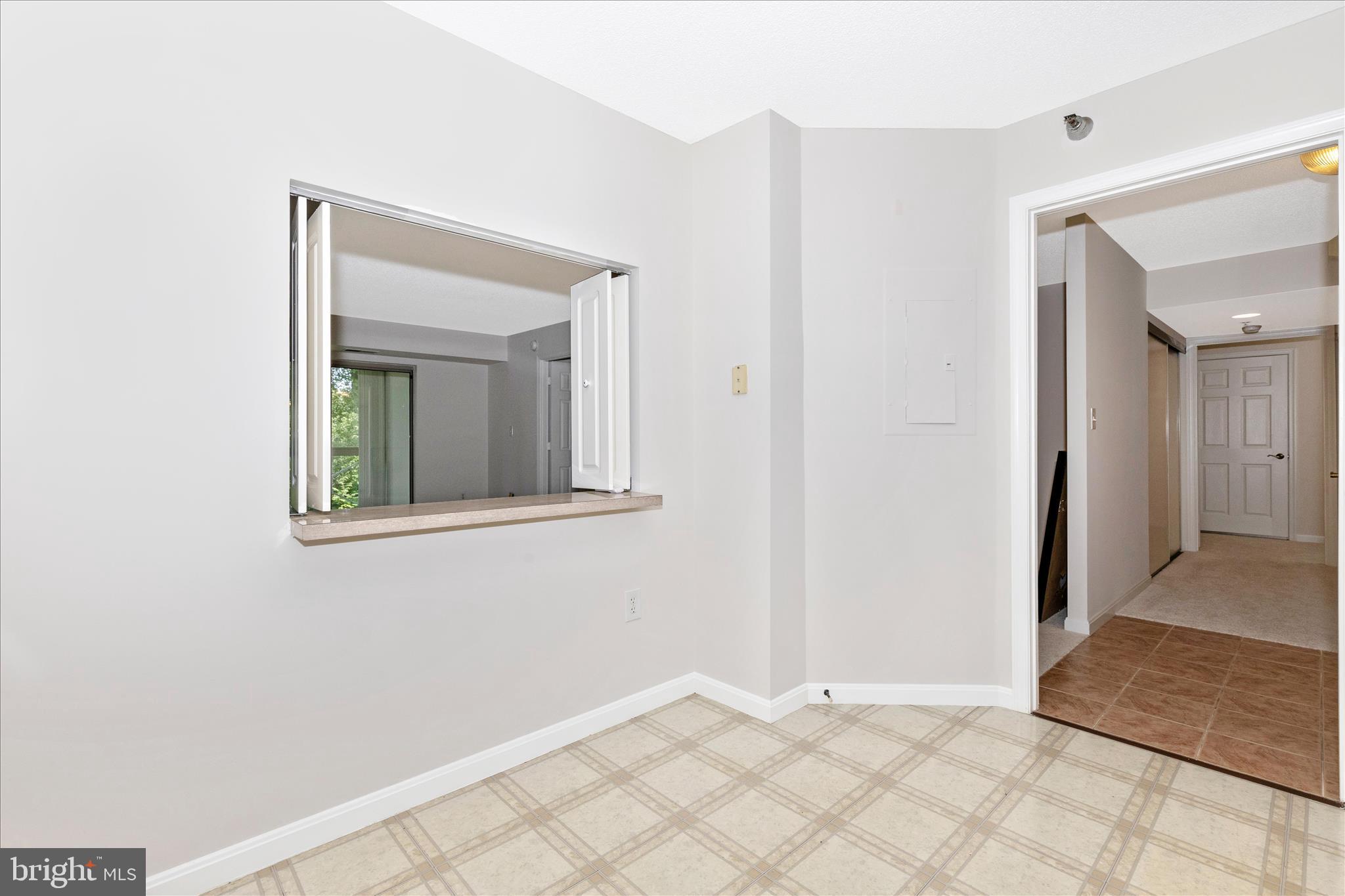 14809 Pennfield Circle, Unit 309 Silver Spring, MD 20906 - Photo 5 of 64 a view of an empty room with window