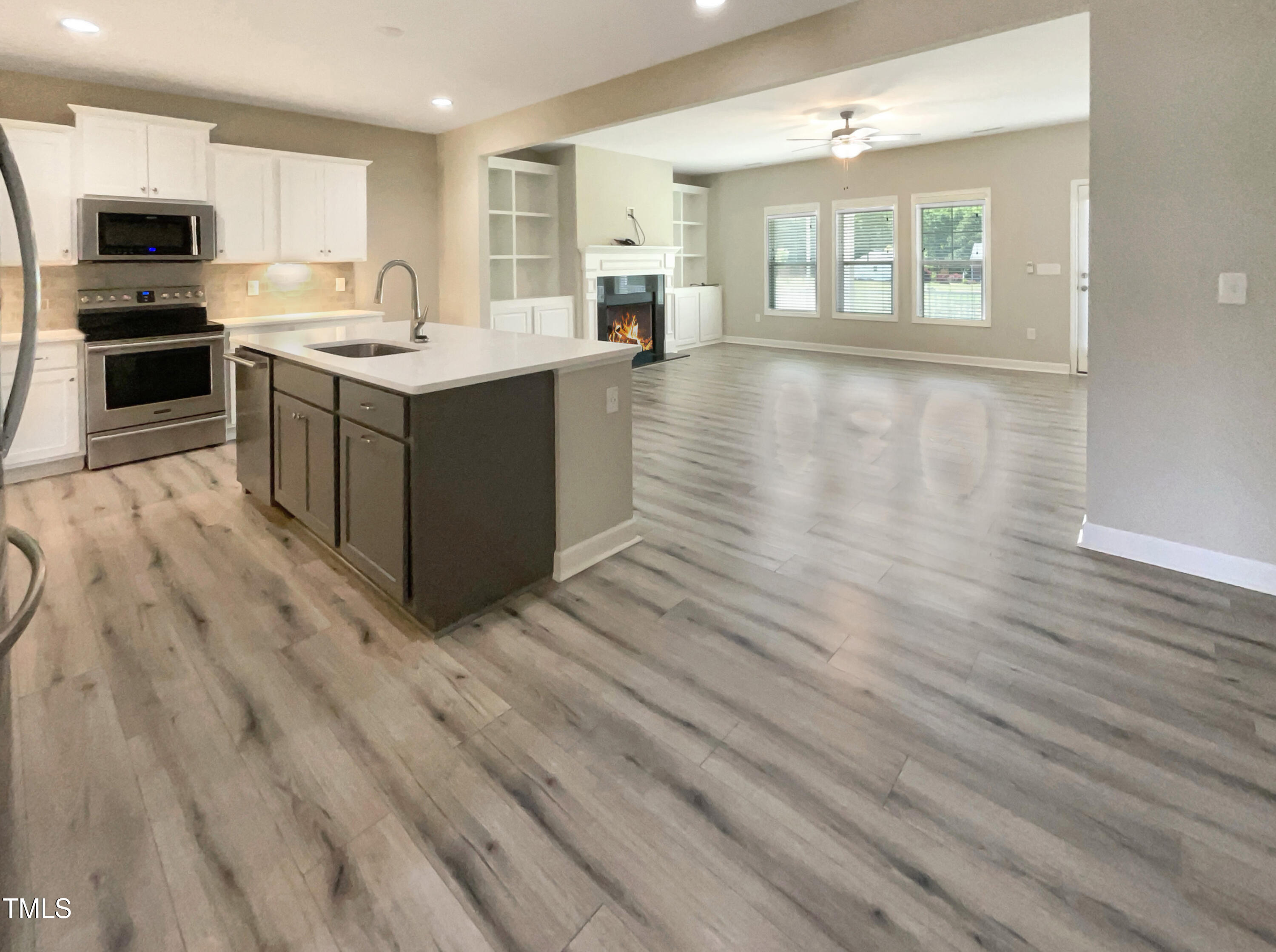 197 Steep Rock Drive Willow Spring, NC 27592 - Photo 11 of 20 an open kitchen with a sink and dish washer