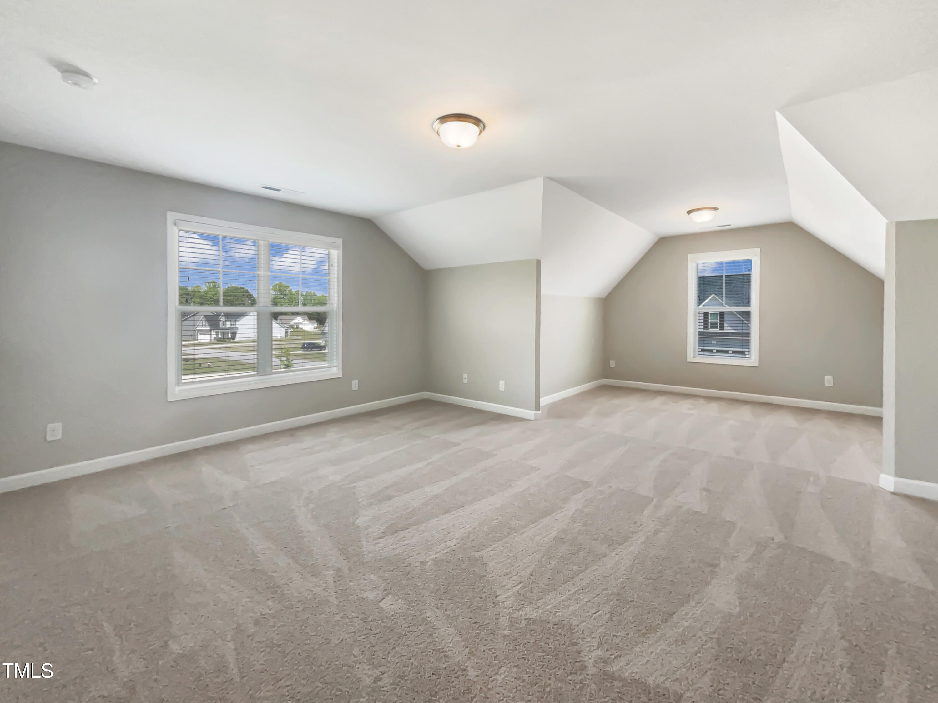 197 Steep Rock Drive Willow Spring, NC 27592 - Photo 17 of 20 a view of an empty room with a window