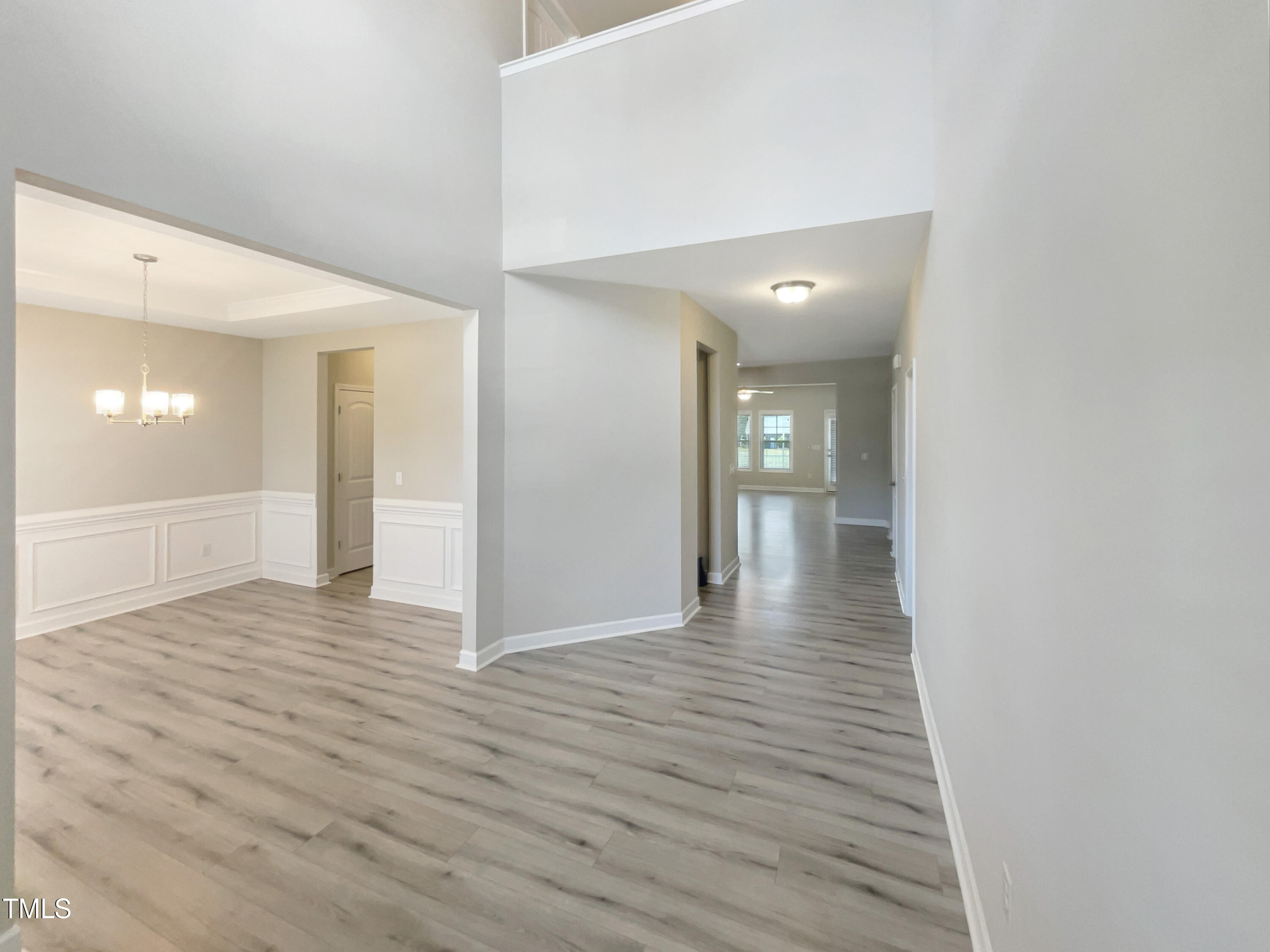 197 Steep Rock Drive Willow Spring, NC 27592 - Photo 9 of 20 a view of a hallway with wooden floor