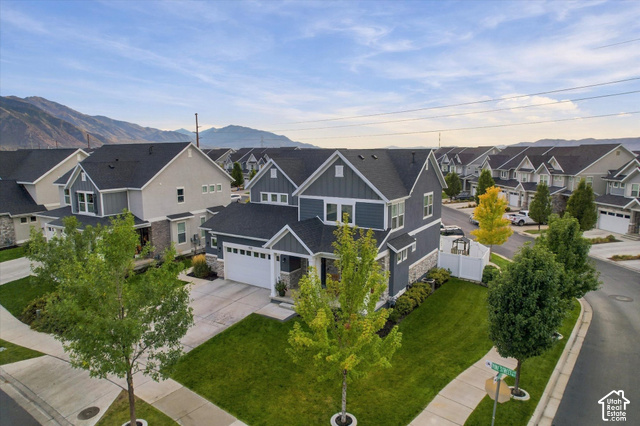 972 Vine Street Mapleton, UT 84664 - Photo 2 of 40 Contemporary two-story residence featuring a dark gray facade, white trim, and a prominent two-car garage