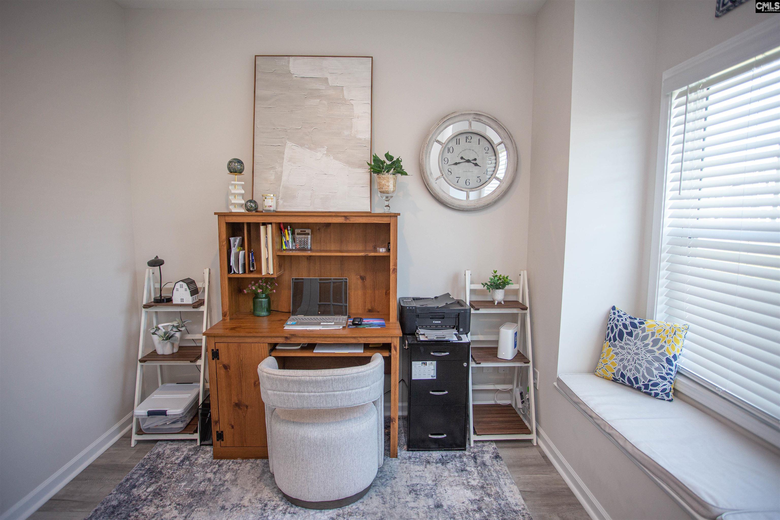 272 Shadowbrook Way Camden, SC 29020 - Photo 33 of 43 a room with furniture a clock and a bookshelf