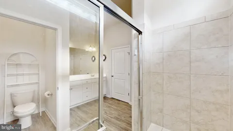 a bathroom with a shower and toilet