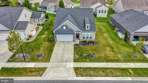a aerial view of a house with a yard