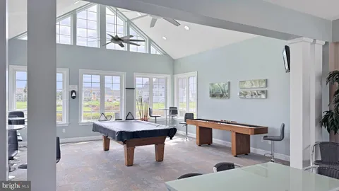 a kitchen with lots of counter top space and dining table