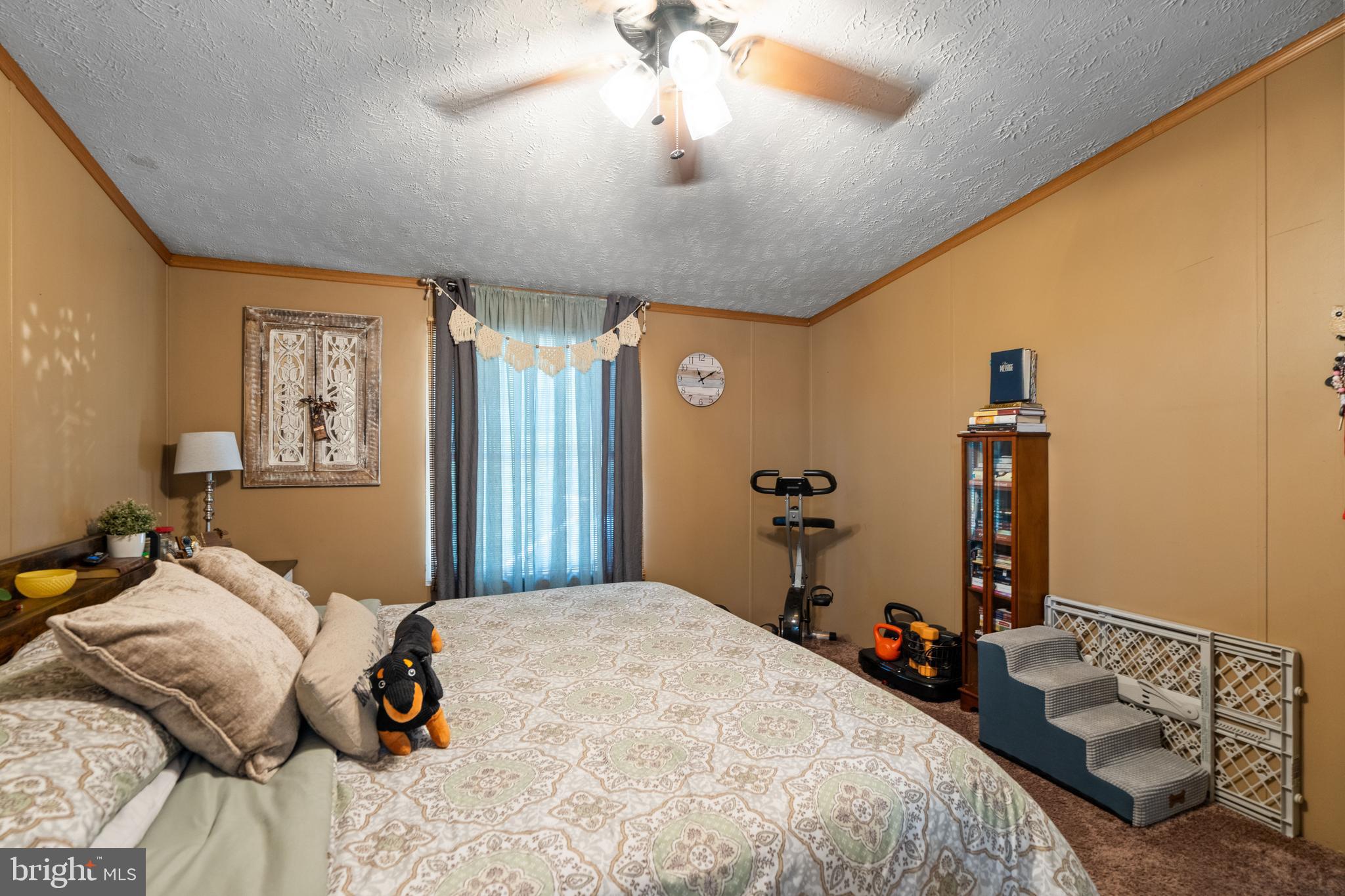 1156 AA Rogers Road Augusta, WV 26704 - Photo 16 of 34 a bedroom with a bed and wooden floor