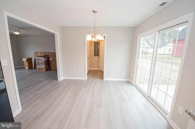 a white toilet sitting next to a white sink