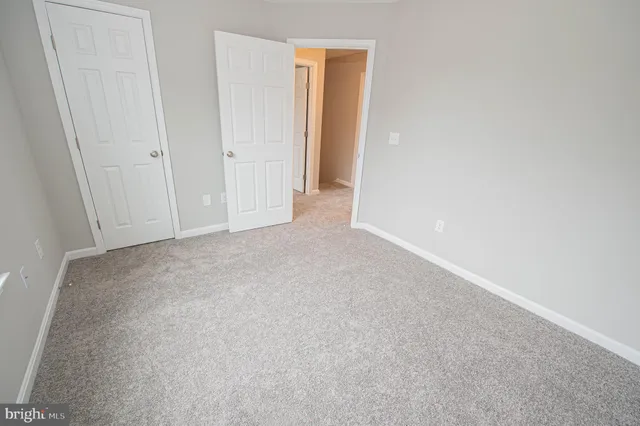 a view of a hallway with closet area