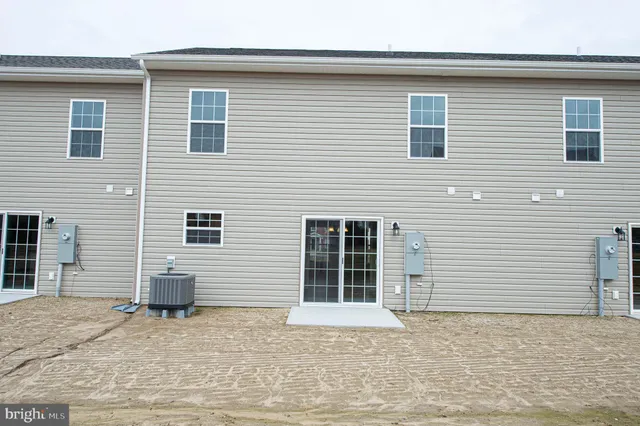 an empty room with wooden floor