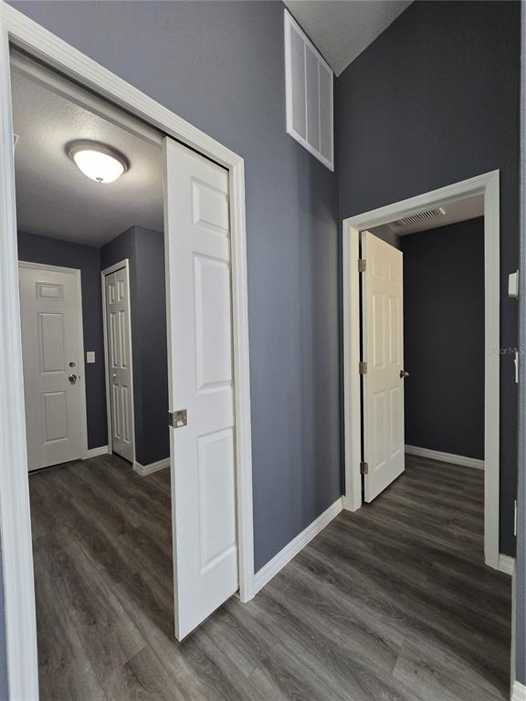 245 Locust Pass Lane Ocala, FL 34472 - Photo 20 of 41 a view of a hallway with wooden floor