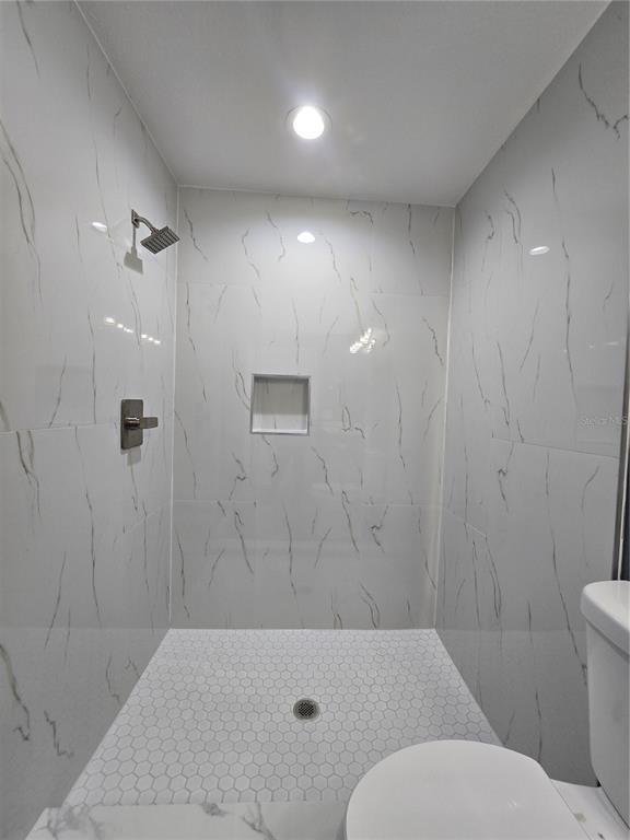 245 Locust Pass Lane Ocala, FL 34472 - Photo 25 of 41 a bathroom with a toilet and a shower