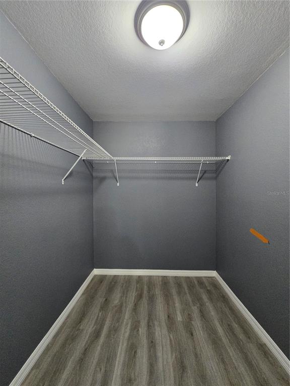 245 Locust Pass Lane Ocala, FL 34472 - Photo 27 of 41 a view of a room with wooden floor