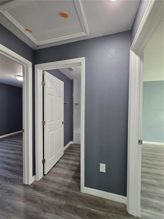 245 Locust Pass Lane Ocala, FL 34472 - Photo 31 of 41 a view of a hallway with wooden floor