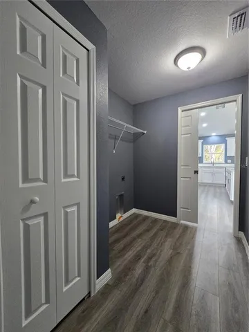 wooden floor in a hall with an entryway
