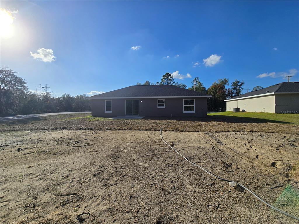 245 Locust Pass Lane Ocala, FL 34472 - Photo 4 of 41 a view of a house with a yard