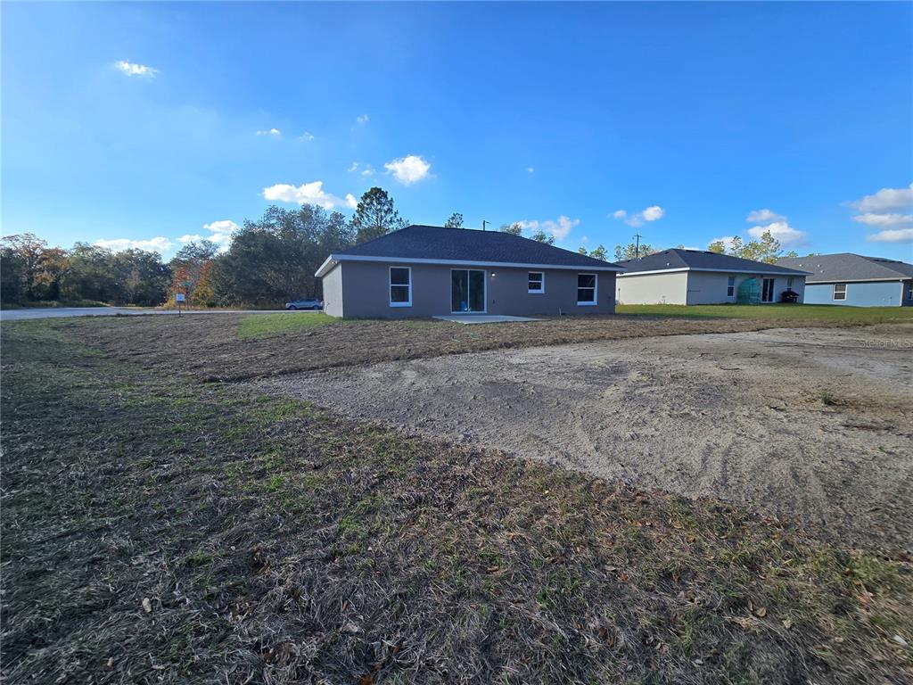 245 Locust Pass Lane Ocala, FL 34472 - Photo 5 of 41 a view of a house with a yard