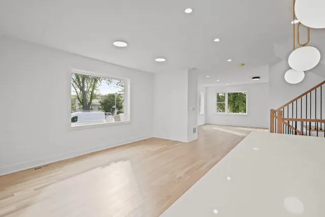 a view of an empty room and a window