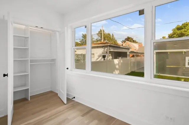 a view of an empty room with a window